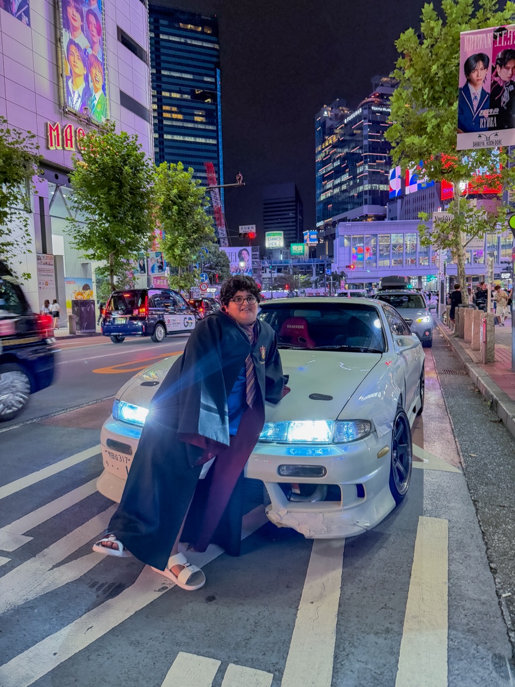 Shibuya Tokyo at night with Nissan Skyline — JDM tour pickup point